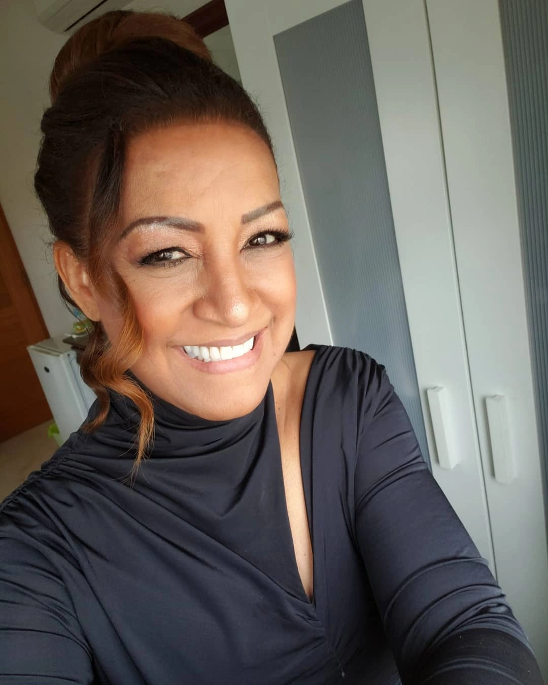 Milly Quezada sonriendo