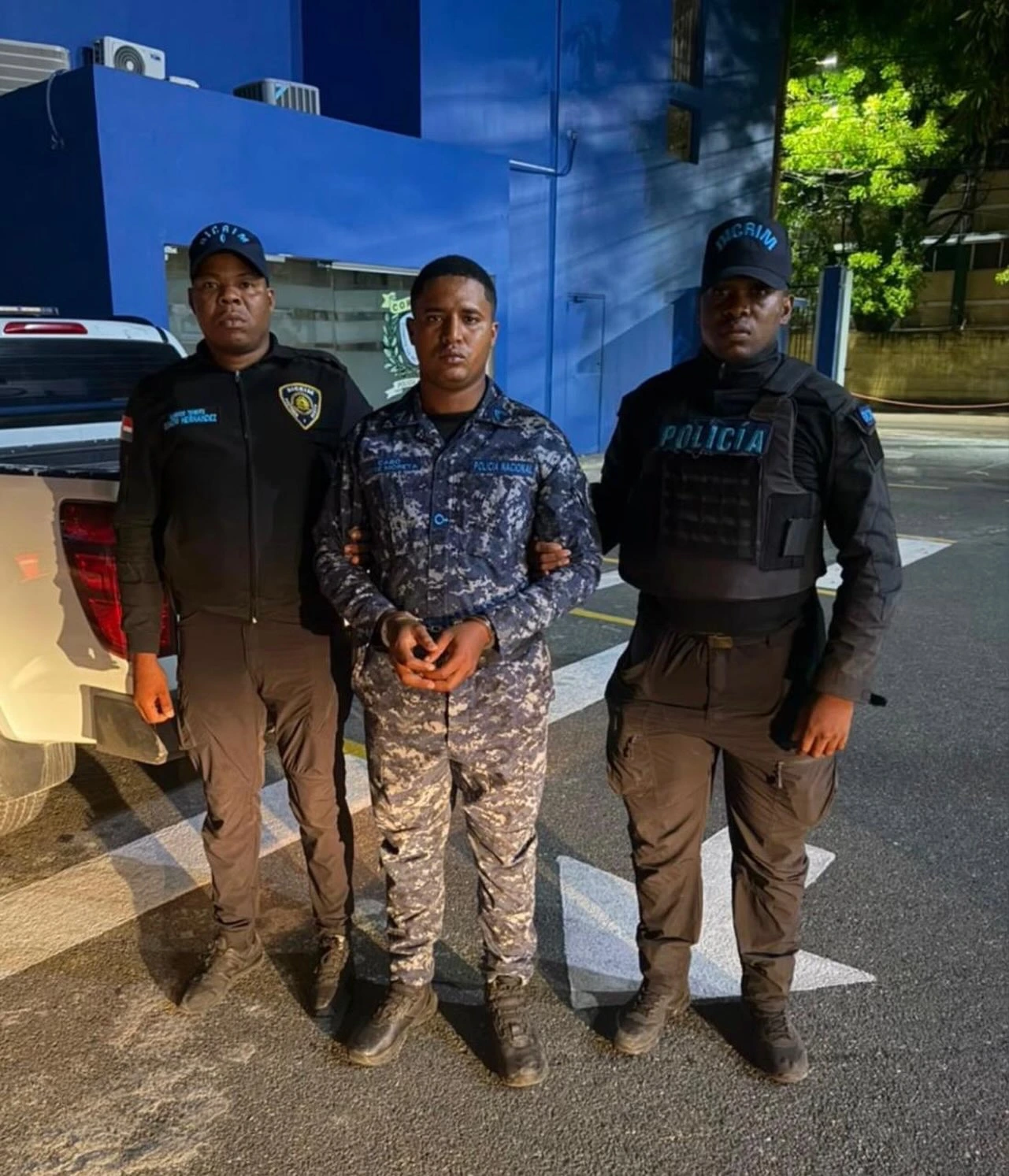Victimario siendo apresado